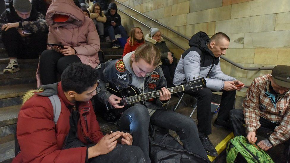 Residents take shelter inside a metro station during an air raid alert in Kyiv (Kiev), Ukraine, 31 December 2022.