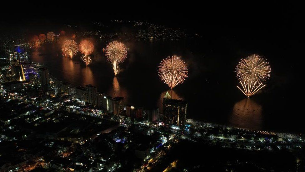 Fireworks illuminate the night sky over Balneario resort city during New Year's celebrations in Acapulco, Mexico