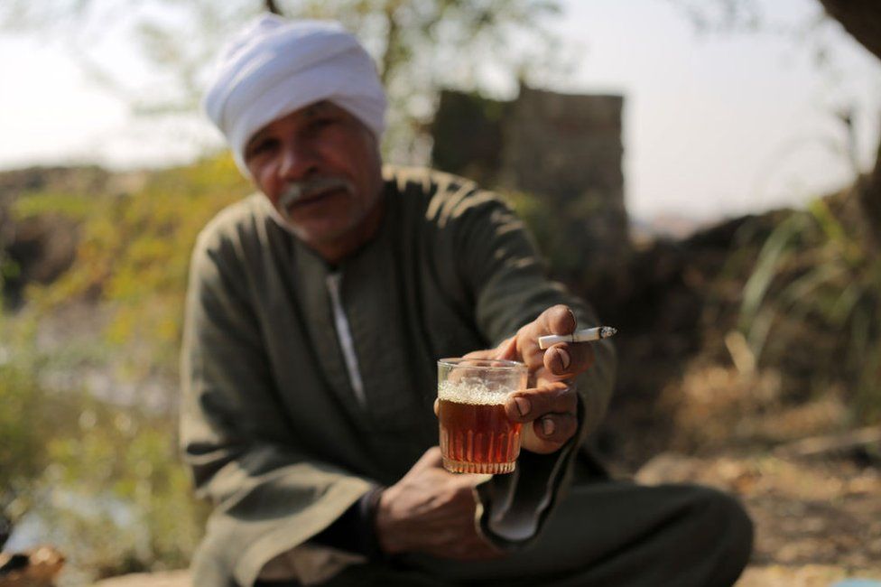 An Egyptian farmer makes tea on his farmland in the Egyptian countryside on January 3, 2023 in Giza, Egypt