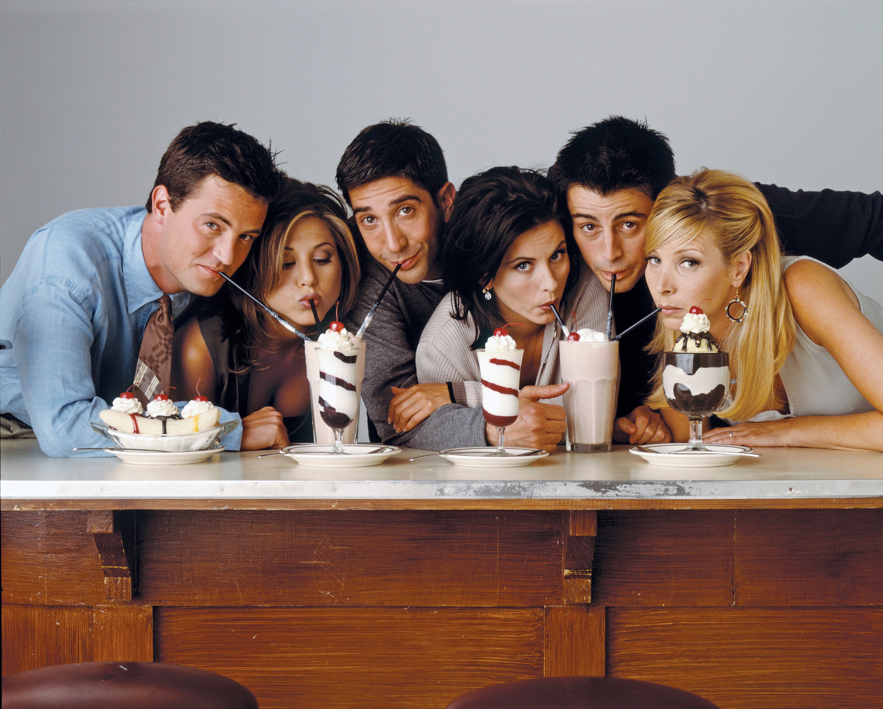 Cast of Friends drinking milkshakes