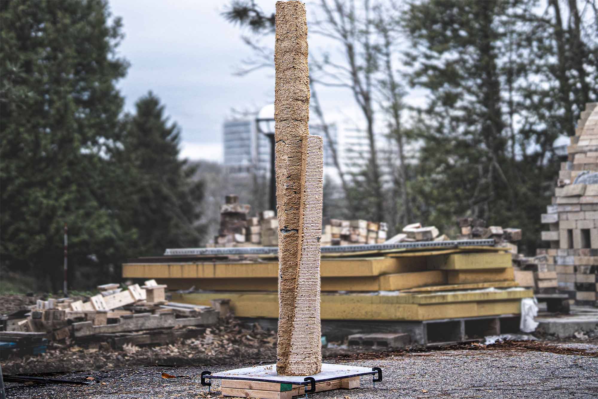 A tower of 3D-printed, sawdust based material stands straight up.