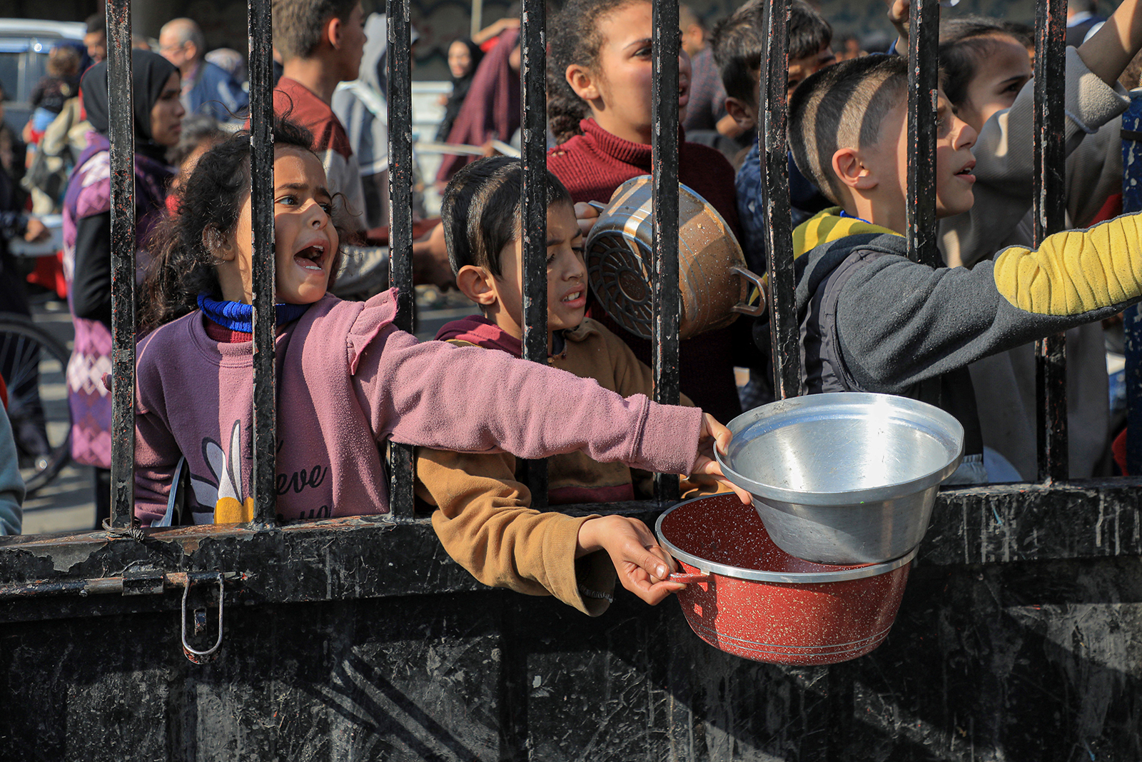 Children cry out for food relief in Rafah, Gaza on December 31, 2023. 